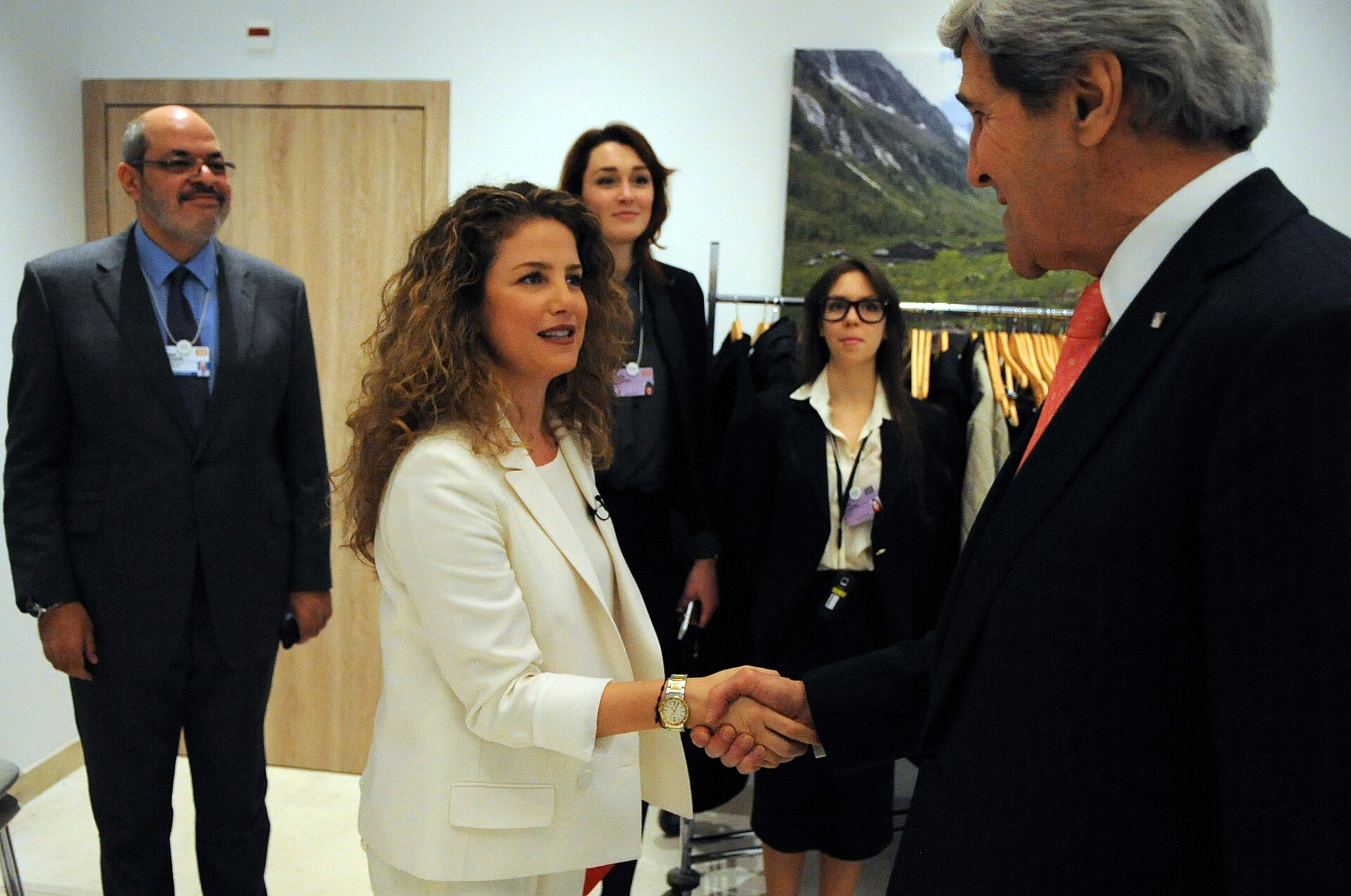 Secretary of State John Kerry greets Al Arabiya anchor Joumana Nammour before a televised interview at the World Economic Forum in Davos, illustrating the network as a platform for high-level diplomatic signaling