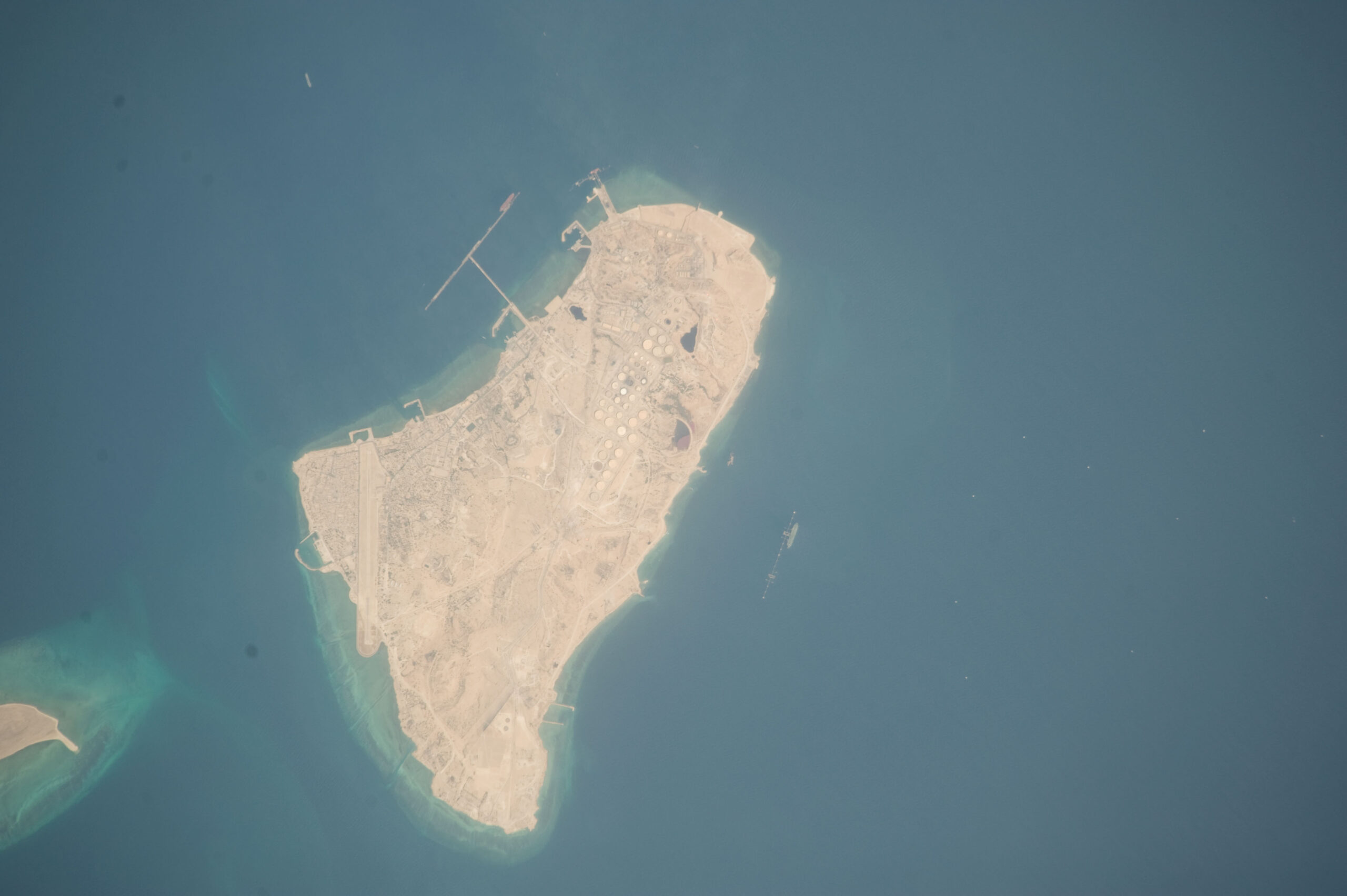 Kharg Island photographed from the International Space Station during ISS Expedition 20. The island handles 90 percent of Iran crude exports through its loading jetties and 34 million barrel storage complex. Photo: NASA / Johnson Space Center / Public Domain