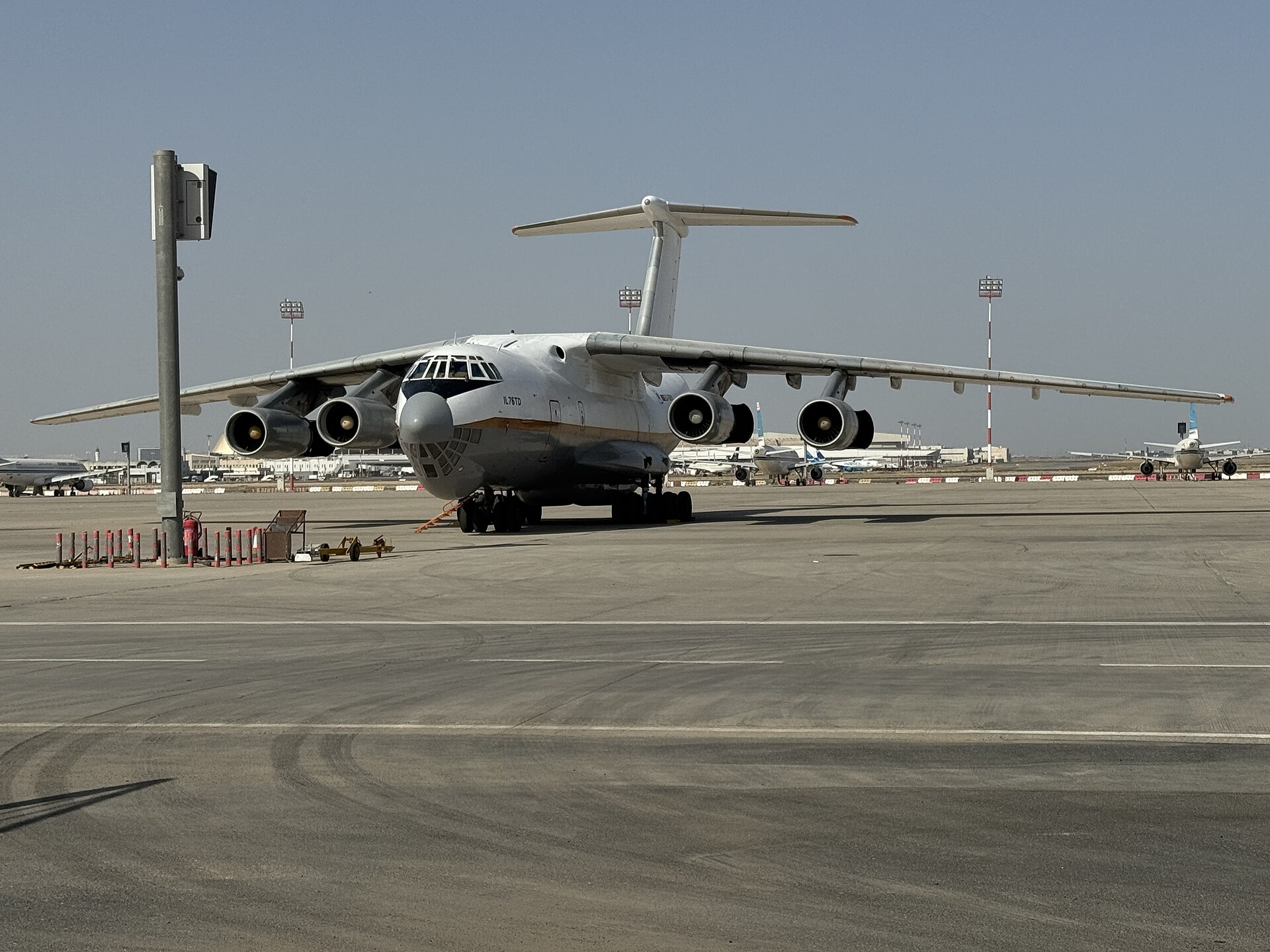 Kuwait International Airport tarmac apron with aircraft, terminal building visible in background