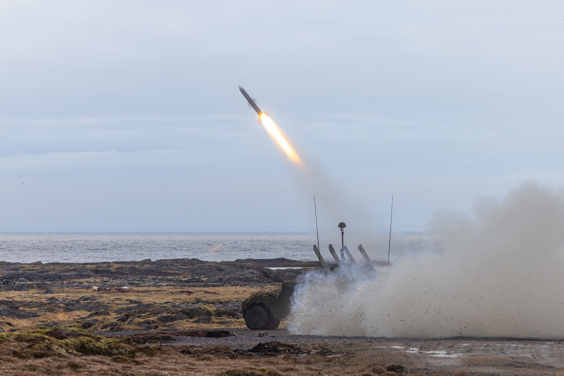 Norwegian NASAMS high-mobility launcher fires an AMRAAM interceptor during exercise Formidable Shield 2023, demonstrating the system Kuwait purchased in its $1.02 billion air defense contract