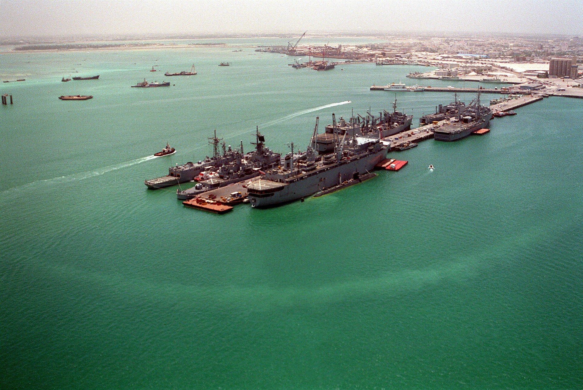 Aerial view of US Navy ships at Naval Support Activity Bahrain (Mina Salman pier), the hub of the US Fifth Fleet headquarters in Juffair