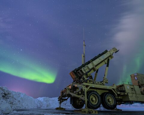 Patriot M903 launcher station assigned to 5th Battalion, 52nd Air Defense Artillery Regiment under northern lights at Eielson Air Force Base, Alaska, during Exercise ARCTIC EDGE 2022