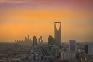 Riyadh skyline at sunset showing Kingdom Tower and King Abdullah Financial District towers under construction