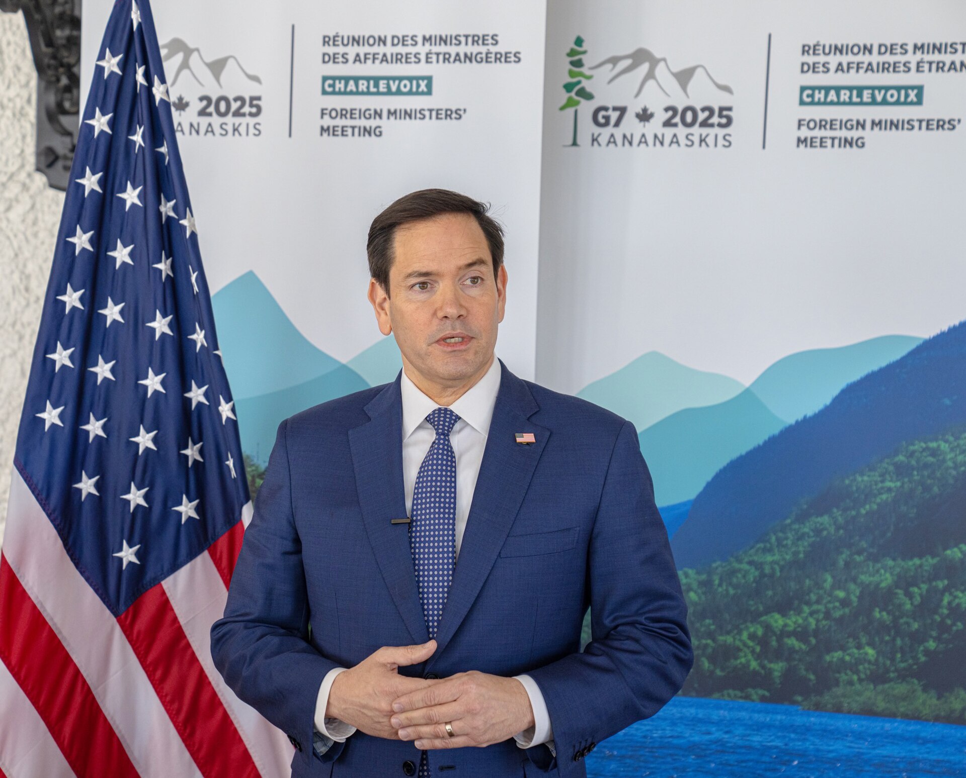 US Secretary of State Marco Rubio speaks at the G7 Foreign Ministers' Meeting in Charlevoix, Quebec, March 2025, with the US flag and G7 2025 Kananaskis banner