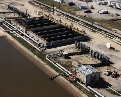 Aerial view of the West Hackberry Strategic Petroleum Reserve site on the Louisiana Gulf Coast, showing brine handling ponds and crude oil storage infrastructure. The SPR has released approximately 58 million barrels since February 2026.