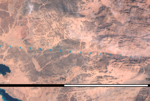 ESA Sentinel-2 satellite mosaic showing The Line excavation trench in northwest Saudi Arabia, October 2022 — the 2.4 km of foundation work visible as a white scar across the desert near the Gulf of Aqaba coast