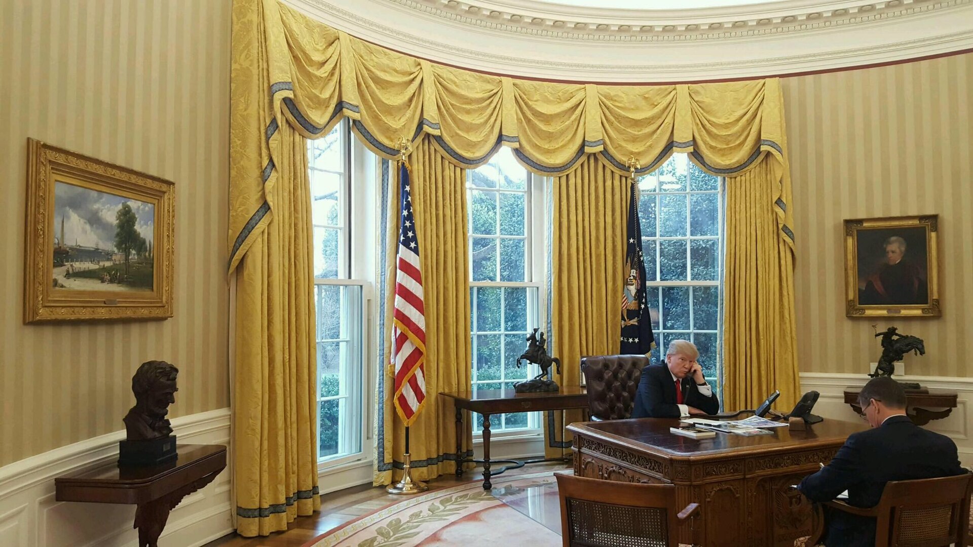 President Trump on the phone in the Oval Office, White House