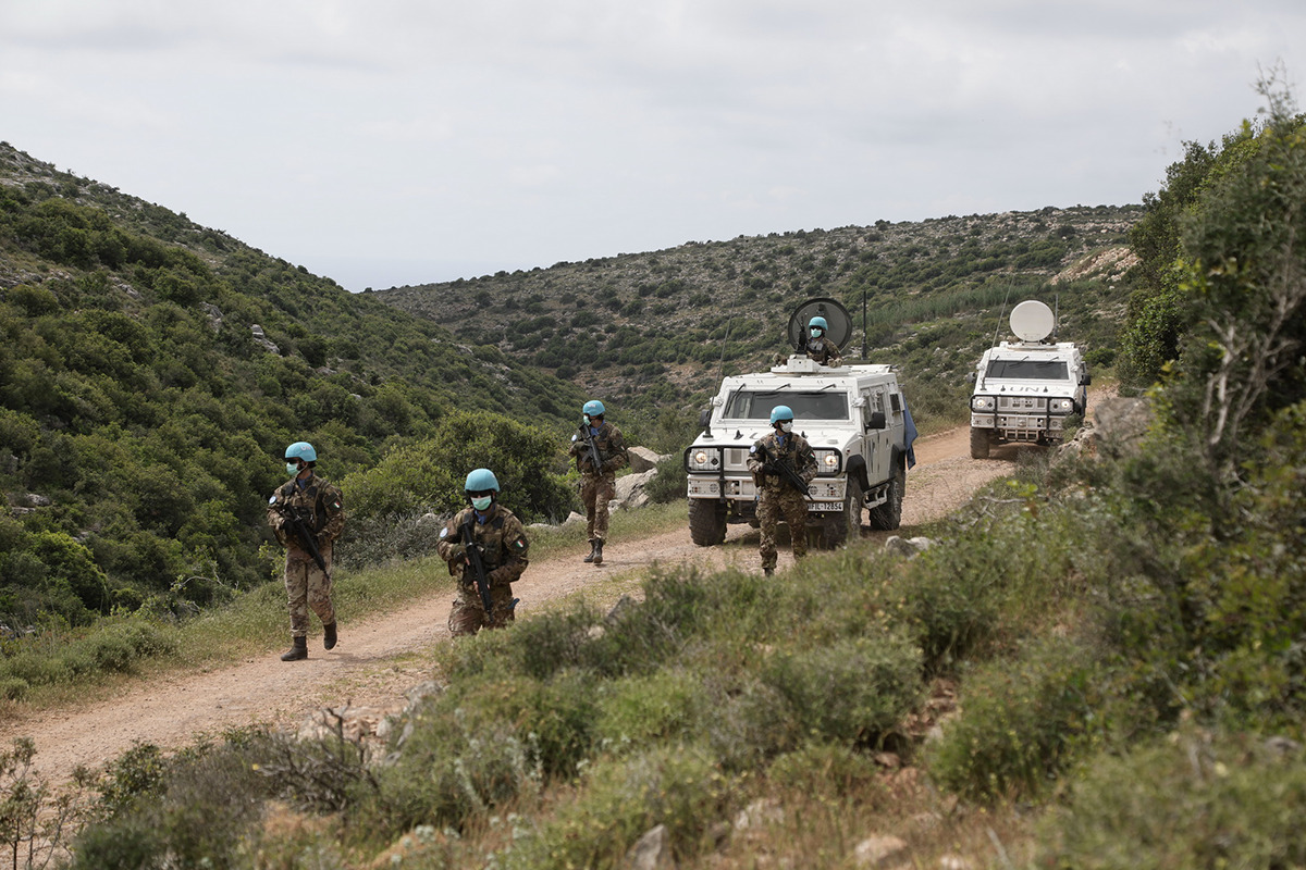 Italian UNIFIL soldiers with UN-marked armored vehicles on patrol in southern Lebanon — the monitoring mechanism whose mandate expires December 31 2026 has no Saudi seat and excludes Hezbollah