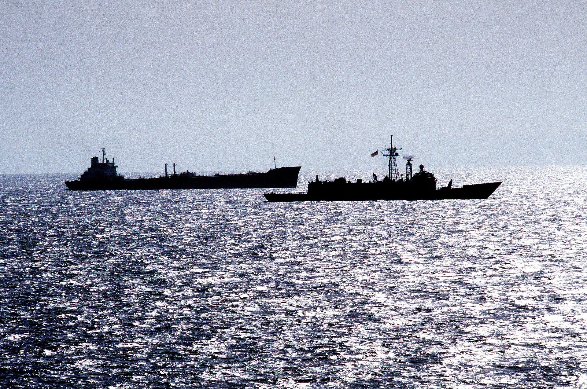 USS Rentz guided missile frigate escorts transport oiler USS Sealift China Sea through the Strait of Hormuz — the waterway where Iran's PGSA now charges approximately $2 million per VLCC transit