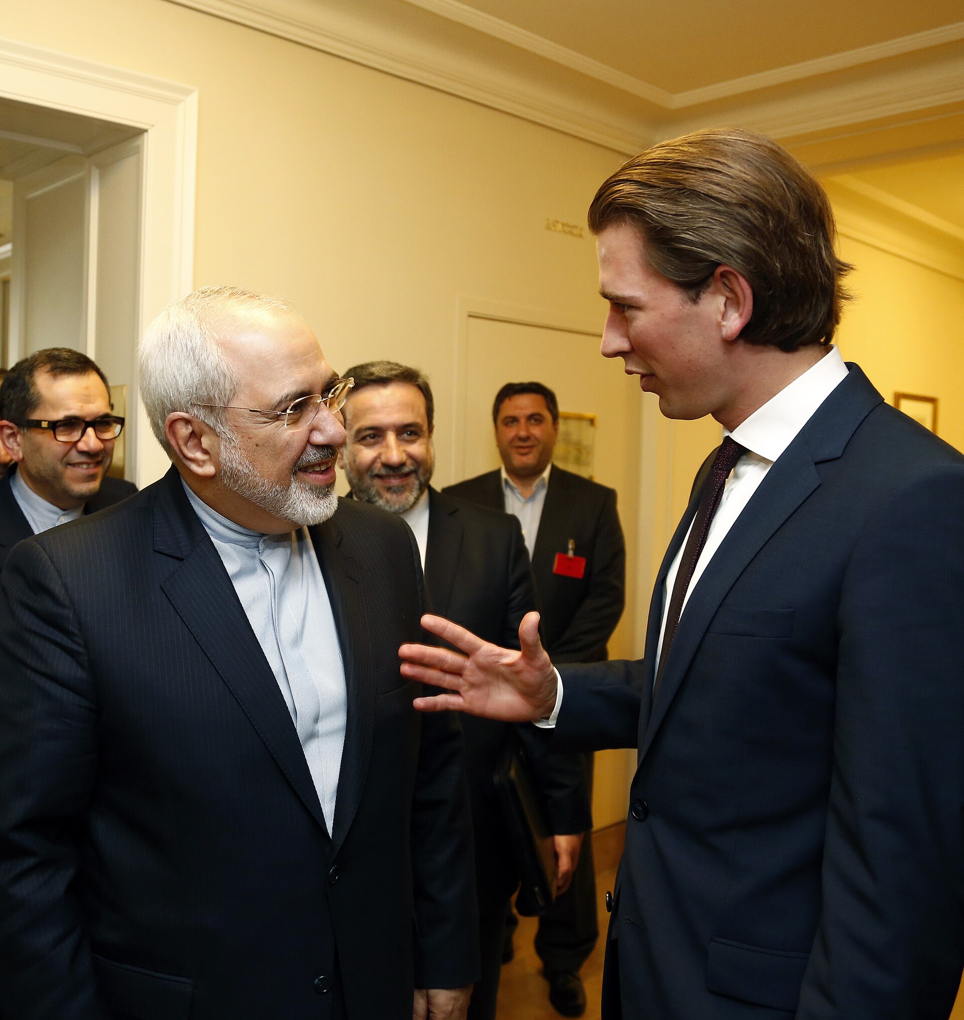 Iranian Foreign Minister Mohammad Javad Zarif greets Austrian Foreign Minister Sebastian Kurz at Palais Coburg in Vienna during JCPOA negotiations in 2014, with Deputy FM Abbas Araghchi visible in background