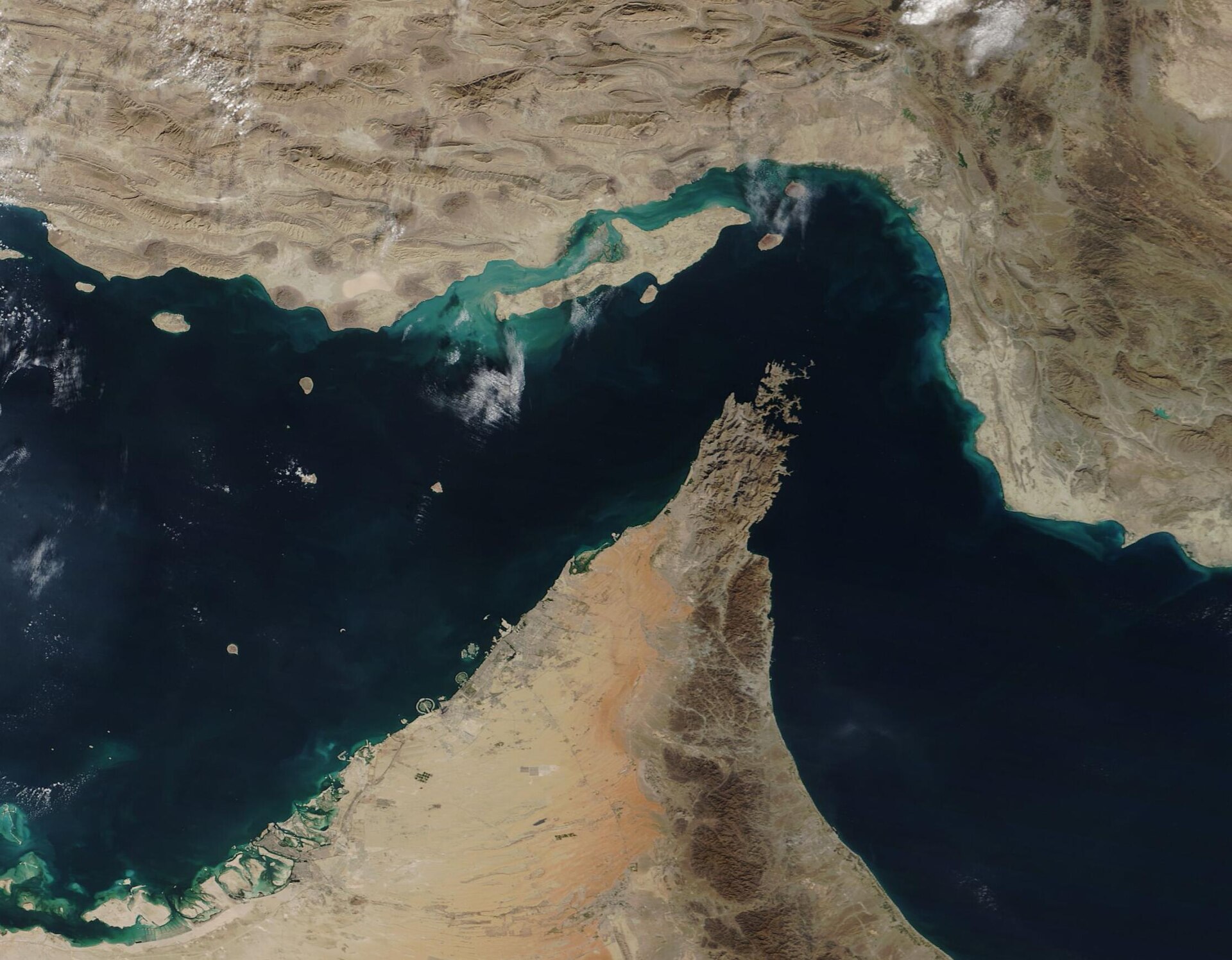 Strait of Hormuz satellite view from NASA MODIS showing Persian Gulf waterway and Musandam Peninsula