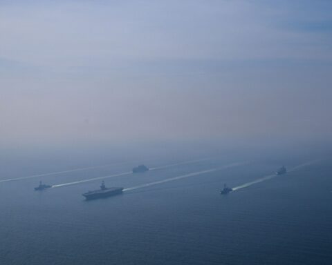 USS Abraham Lincoln carrier strike group underway in 2026, with guided-missile destroyers in formation