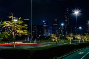 Abu Dhabi skyline at night viewed from the Corniche promenade, UAE
