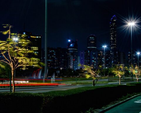 Abu Dhabi skyline at night viewed from the Corniche promenade, UAE