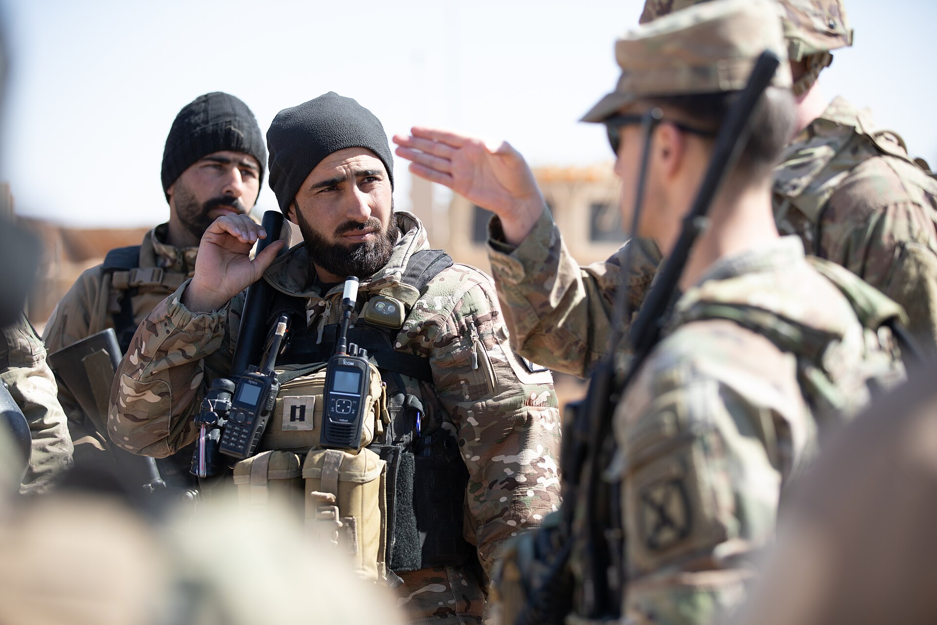 US Army soldiers and Syrian partner forces at Al-Tanf Garrison, southeastern Syria. Al-Tanf — previously targeted only by Iranian-backed militias — absorbed its first direct IRGC strike on July 17, 2026, marking the campaign's expansion to a sixth sovereign territory.
