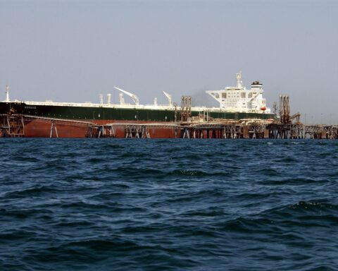 Aramco supertanker AbQaiq receives crude oil at an offshore Gulf loading terminal — at 2 million barrels per loading, the economics of every Ras Tanura cargo are now set by the July OSP cut