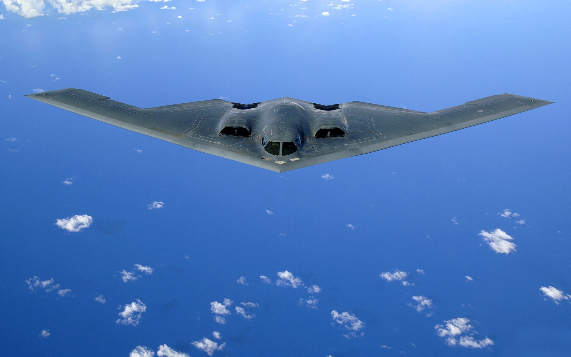 A B-2 Spirit stealth bomber in flight — the aircraft that delivered fourteen GBU-57 Massive Ordnance Penetrators in Operation Midnight Hammer against Fordow and Natanz in June 2025