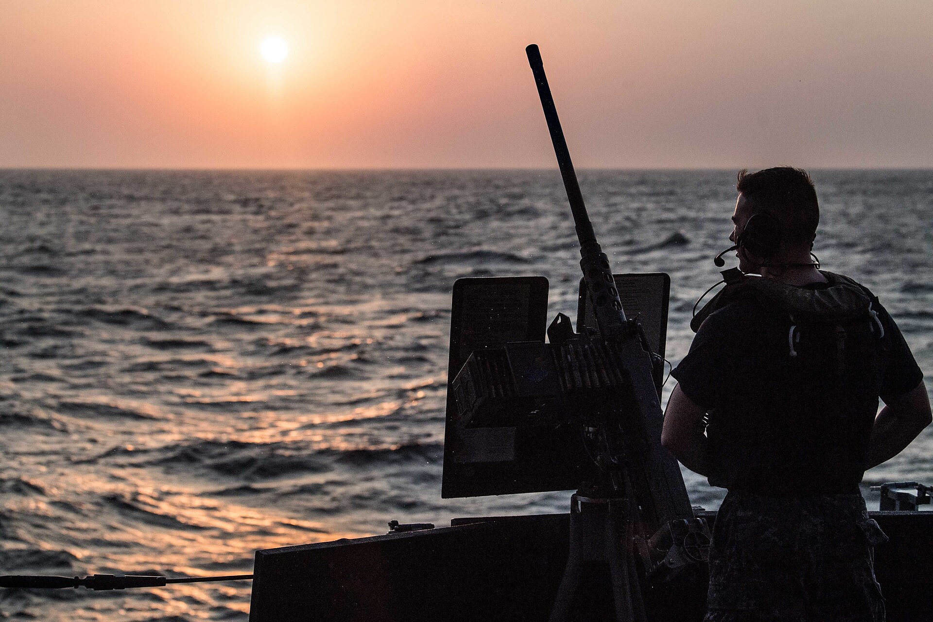 A US Navy sailor stands watch at the Bab al-Mandeb strait between Djibouti and Yemen, the 32-kilometre choke point now under declared Houthi blockade