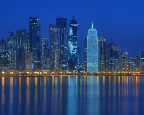 Doha West Bay district at night, seen from the corniche — the city that hosted US-Iran technical talks on frozen assets on July 1, 2026