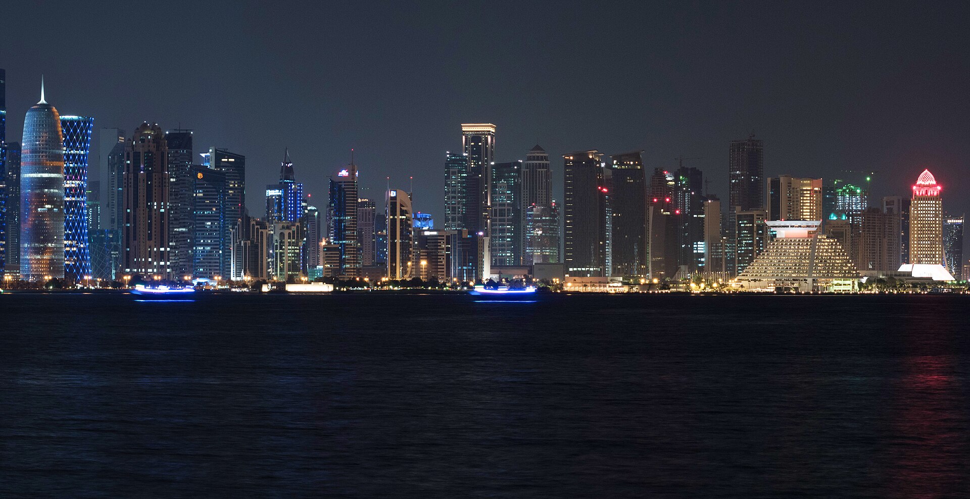 Doha West Bay financial district at night, Qatar — venue for US-Iran diplomatic contacts in July 2026. Photo: Nmnogueira / CC BY-SA 4.0