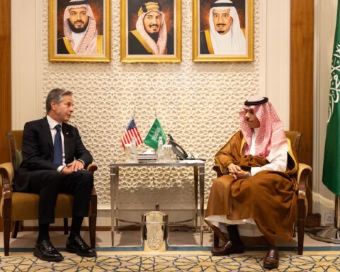 Saudi Foreign Minister Prince Faisal bin Farhan meets with US Secretary of State Antony Blinken in a formal diplomatic setting with Saudi and US flags visible, October 2023