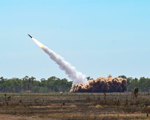 An MGM-140 ATACMS missile launches from a US Army M142 HIMARS system during exercise Talisman Sabre 23 at Delamere Air Weapons Range, Australia, July 2023 — the same weapons system the Wisconsin National Guard fired from Kuwait against Iranian military targets since February 2026