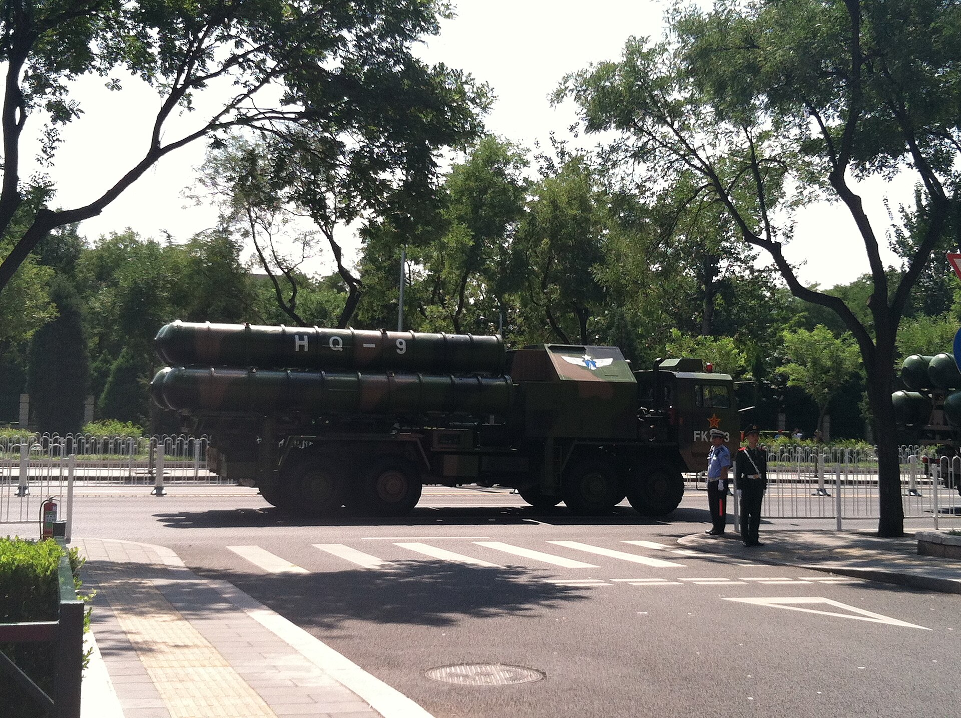 HQ-9 surface-to-air missile launcher at the September 2015 Beijing military parade — the system Pakistan deployed to Saudi Arabia under the SMDA with a maximum engagement ceiling of fifty kilometres, below the forty-to-seventy-kilometre glide corridor the Fattah-2 exploits