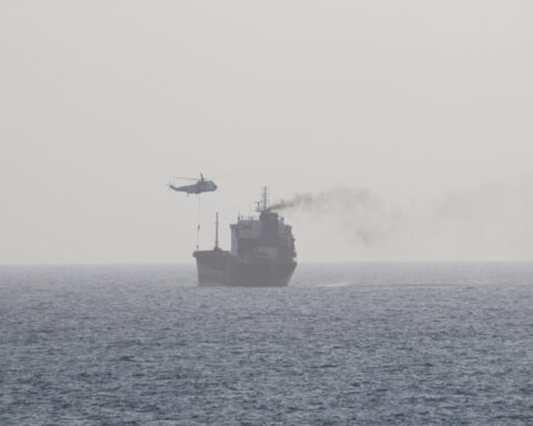 Iranian military helicopter hovers over merchant tanker MT Wila in the Arabian Gulf as IRGC naval forces conduct a boarding operation, August 2020