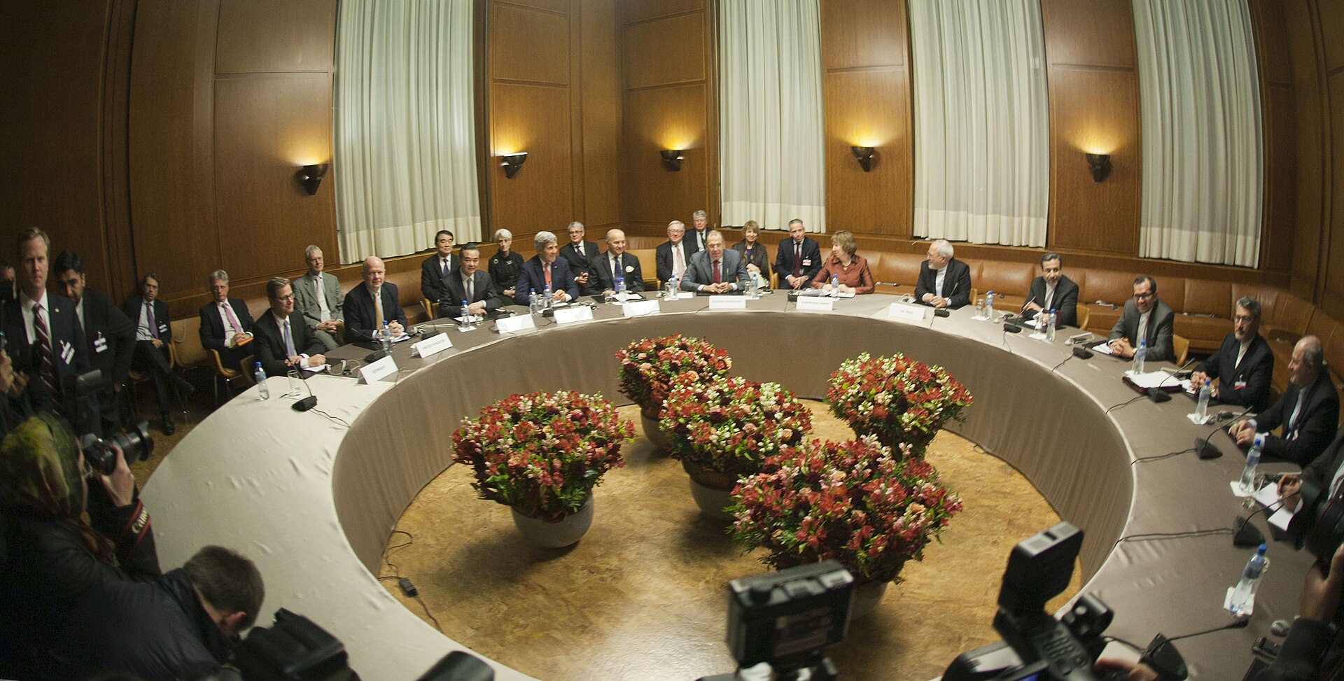 Foreign ministers of the P5+1 nations and Iran seated at the round table in Geneva for nuclear negotiations — the multilateral diplomatic framework Iran rejected in parallel with the US-Saudi 123 agreement signing on July 22, 2026
