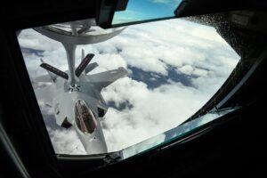 An F-35A Lightning II connects to the flying boom of a KC-135 Stratotanker during aerial refueling. Prince Sultan Air Base operates thirteen KC-135s that sustain US air operations over the Gulf — the fleet that makes Nasr-2 targeting decisions about PSAB strategically consequential.