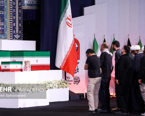 Flag-draped coffins and Iranian flags at the Grand Mosalla state funeral ceremony for Supreme Leader Khamenei, Tehran, July 2026