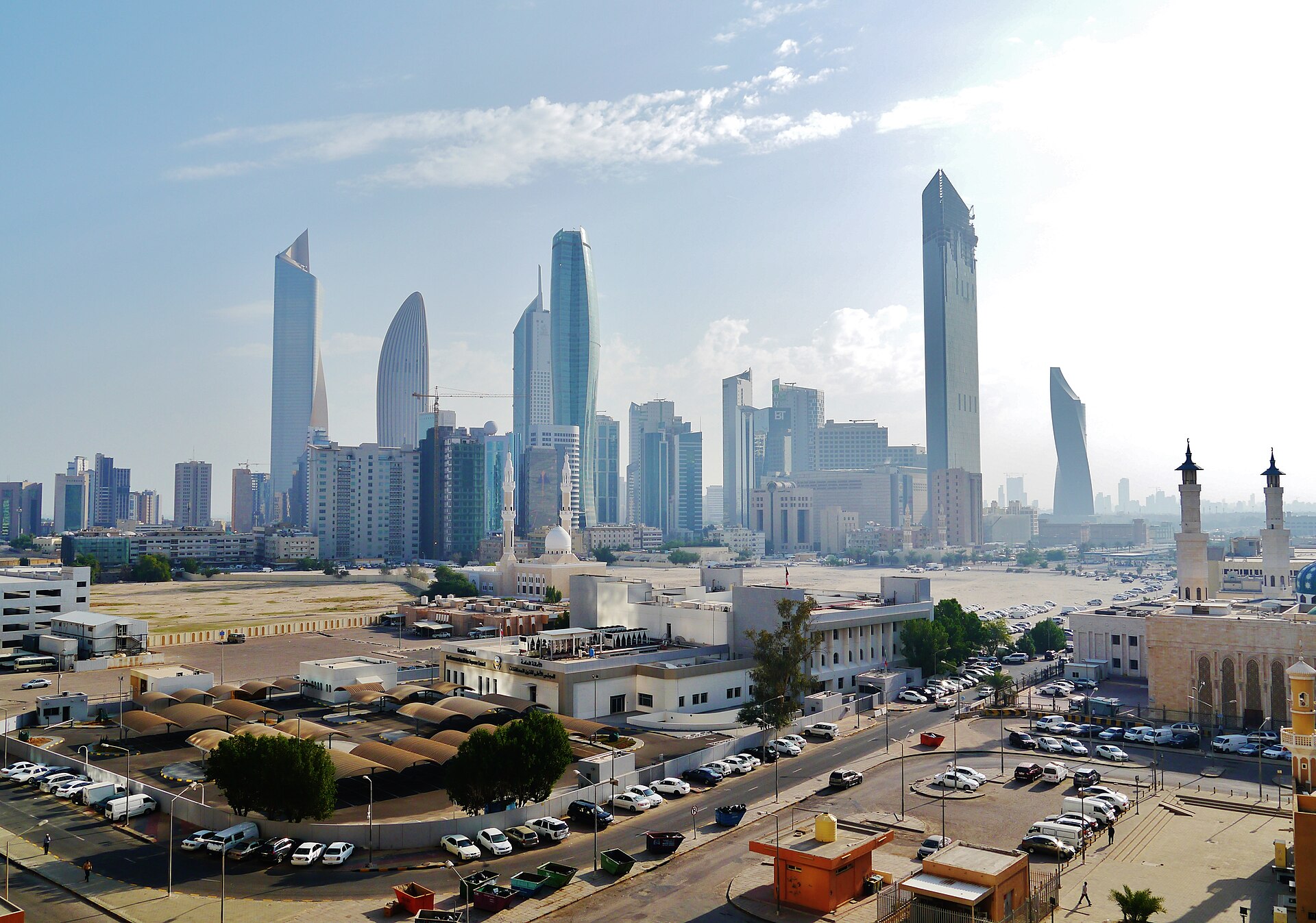 Kuwait City skyline showing modern high-rise district. Kuwait International Airport suspended operations on July 18 after IRGC Operation Nasr-2 Wave 19 barrage struck the fuel pier at Mina Al-Ahmadi port