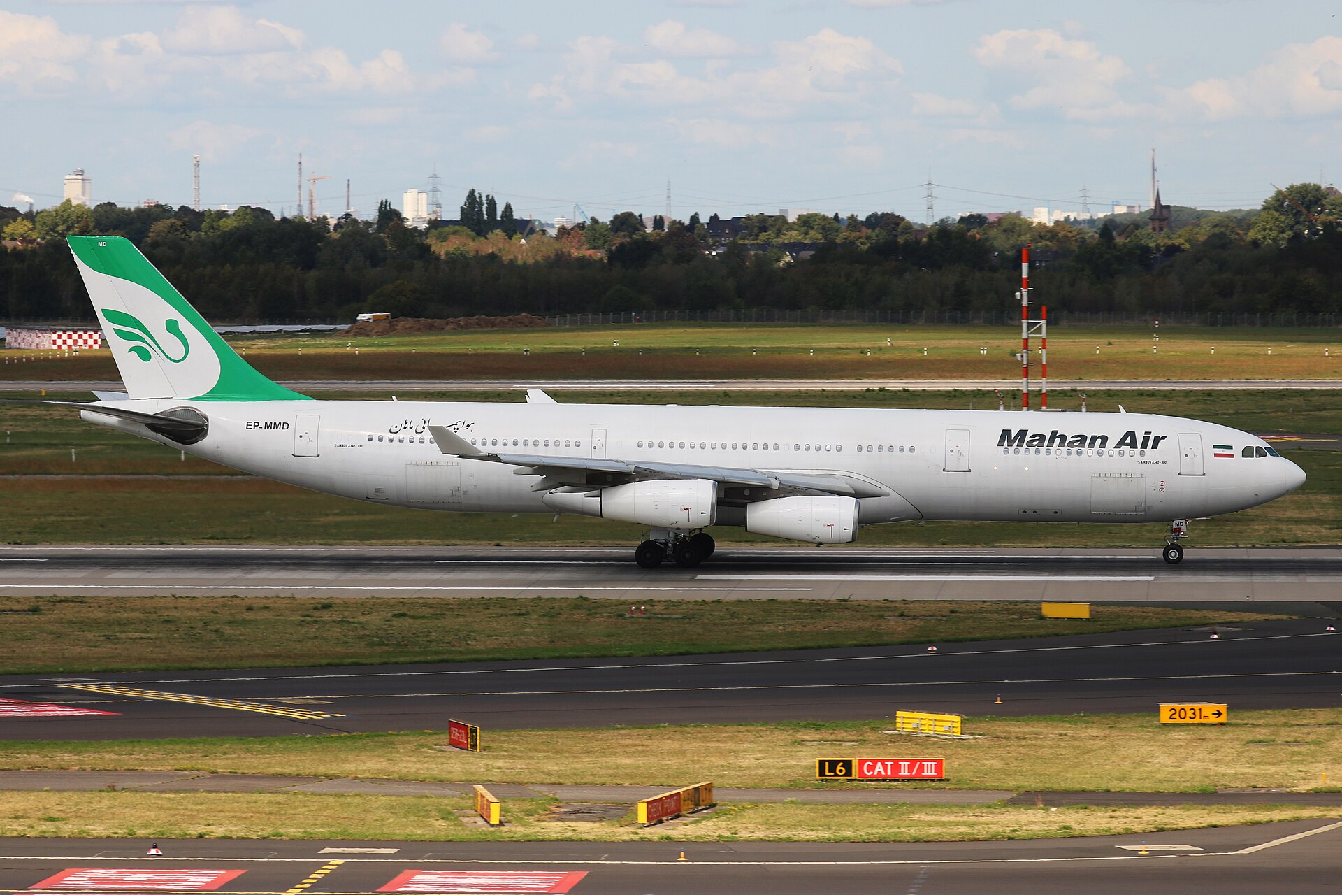 Mahan Air Airbus A340-300 EP-MMD taxiing at Dusseldorf Airport showing Iranian registration and green white livery