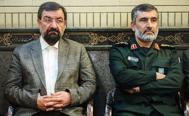 Mohsen Rezaei (left), Supreme Leader military adviser and longest-serving IRGC commander, photographed with IRGC Aerospace Forces commander Amir Ali Hajizadeh. On July 17, 2026, Rezaei declared on state television that conditions for both war and negotiation were over.