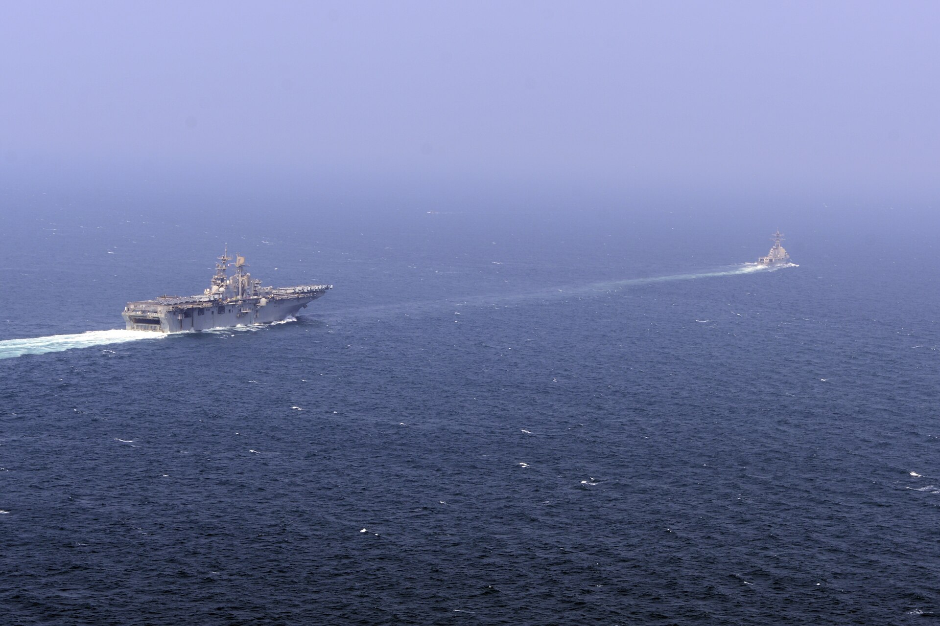 USS Roosevelt (DDG-80) escorts USS Bataan (LHD-5) through the Strait of Hormuz, September 2014 — the same chokepoint now patrolled by the 38-nation Franco-British multinational mission Saudi Arabia did not join