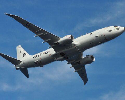 US Navy P-8A Poseidon maritime patrol aircraft in flight, showing sensor dome and twin-engine configuration used for Gulf surveillance operations