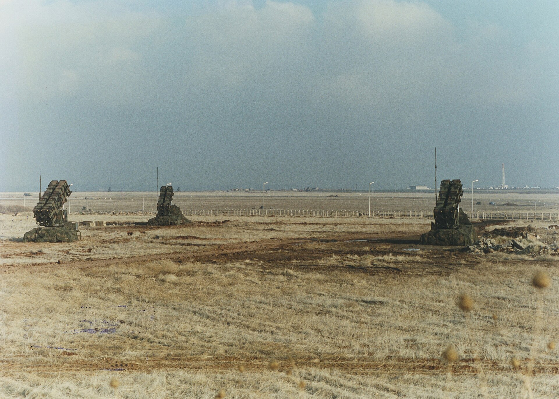 Dutch MIM-104 Patriot missile battery deployed at Diyarbakir Air Base Turkey showing multiple launchers on arid plain similar to Gulf air base deployments