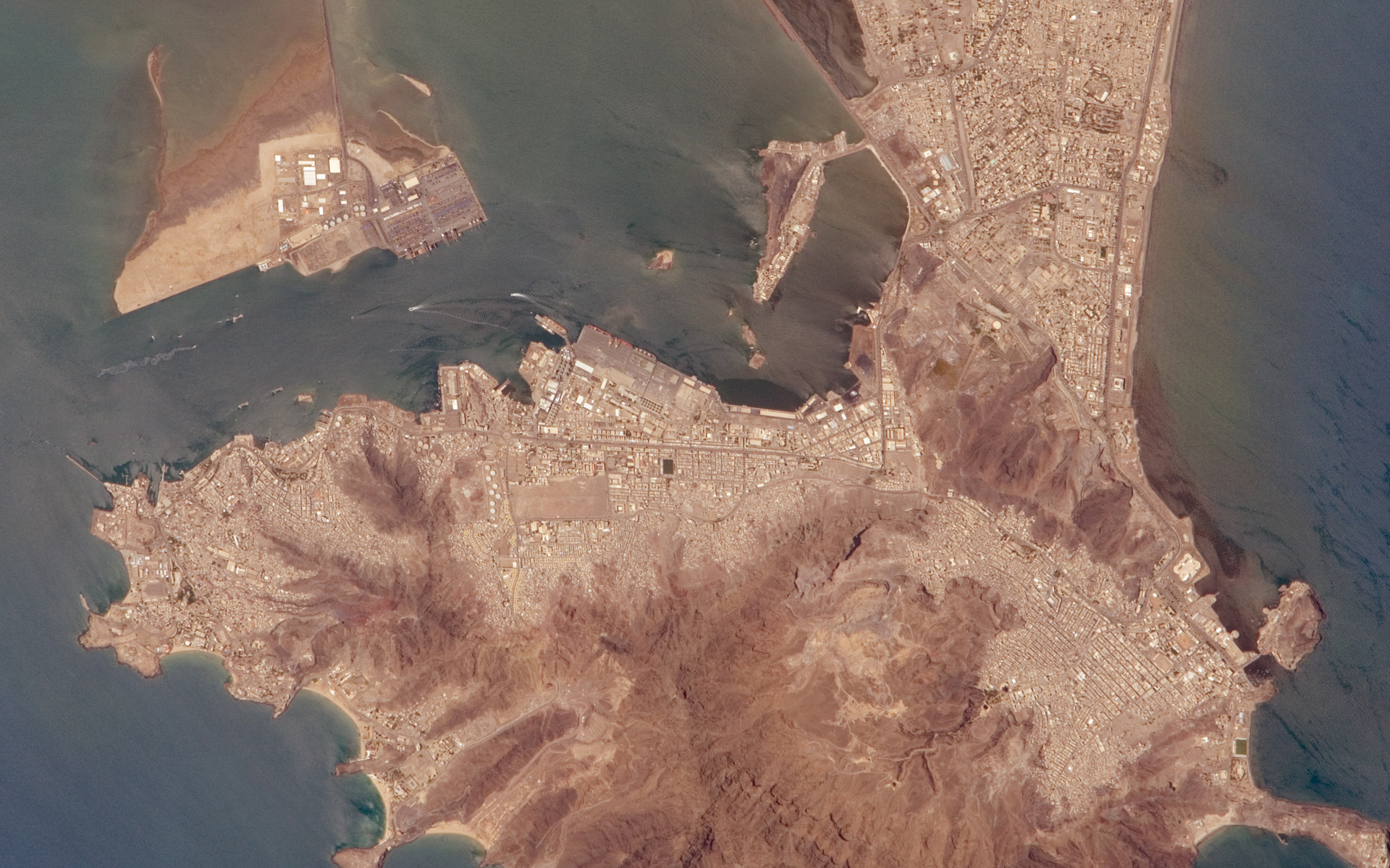 Port of Aden Yemen from ISS, showing the harbor port infrastructure and volcanic peninsula from orbit, 2016