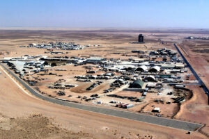 Aerial view of Prince Sultan Air Base, Saudi Arabia, showing the Maintenance City compound and base infrastructure, circa 1994