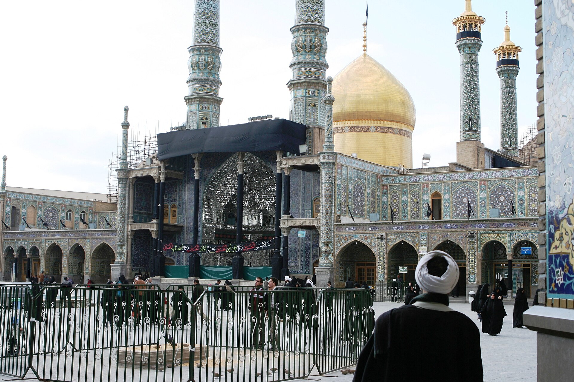 Exterior of the Fatima Masumeh Shrine in Qom, Iran, with its distinctive golden dome and minarets, the religious center that Pezeshkian visited on June 28 2026 to seek clerical legitimacy for the Islamabad MOU
