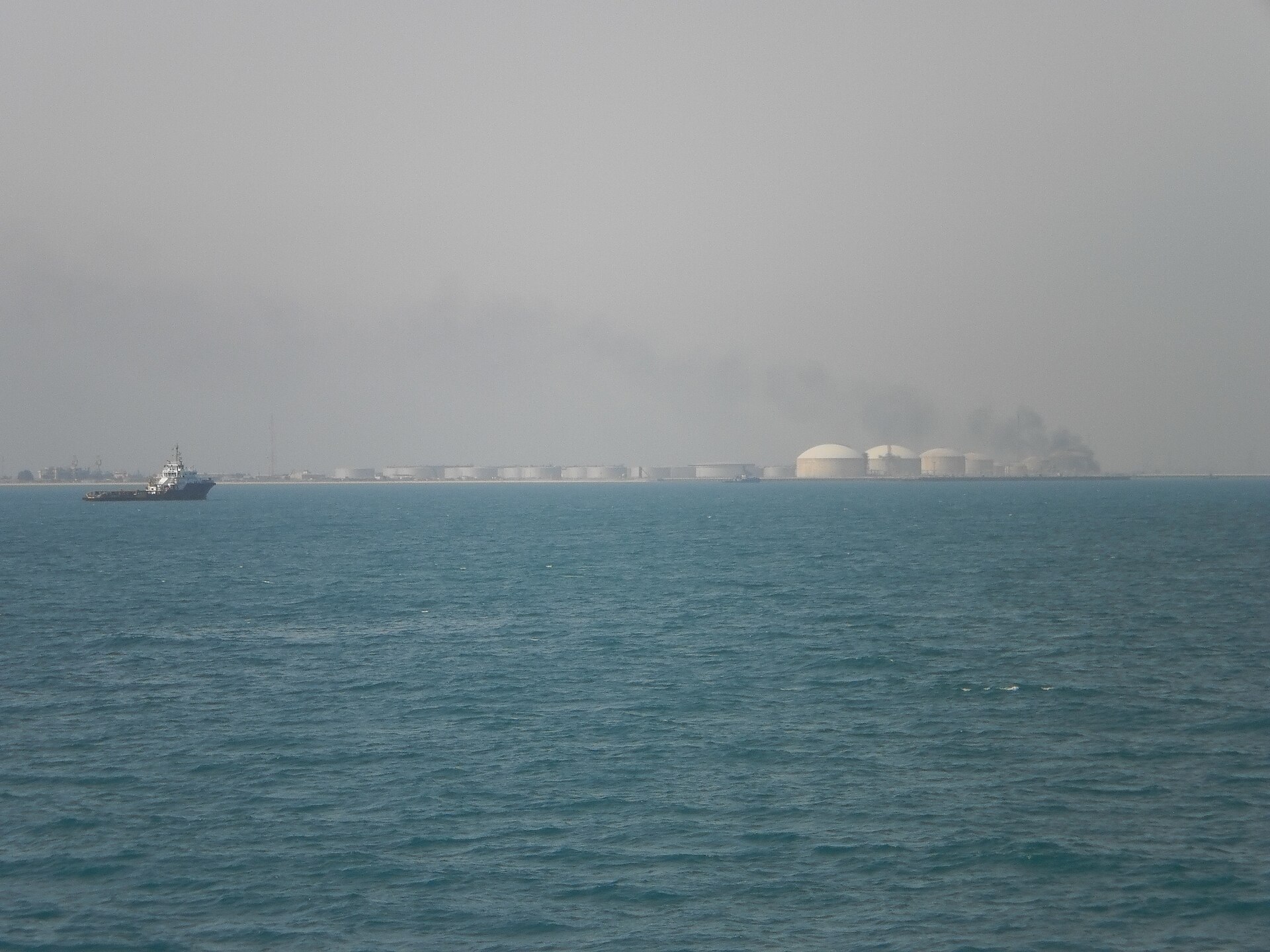 Ras Tanura oil refinery storage tanks Saudi Arabia viewed from Persian Gulf with vessel