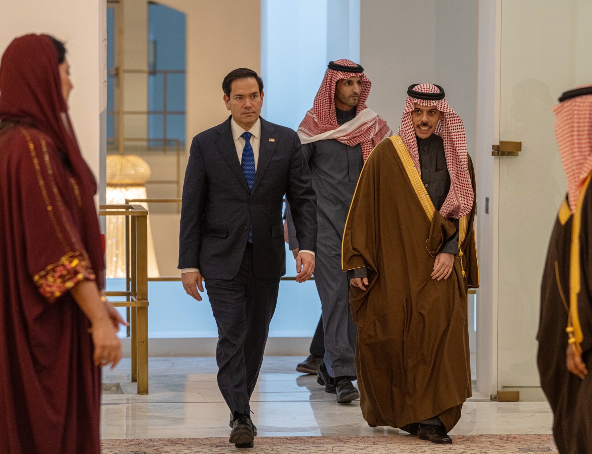 Secretary Marco Rubio and Saudi Foreign Minister Faisal bin Farhan walking together at the Saudi Ministry of Foreign Affairs in Riyadh, February 2025