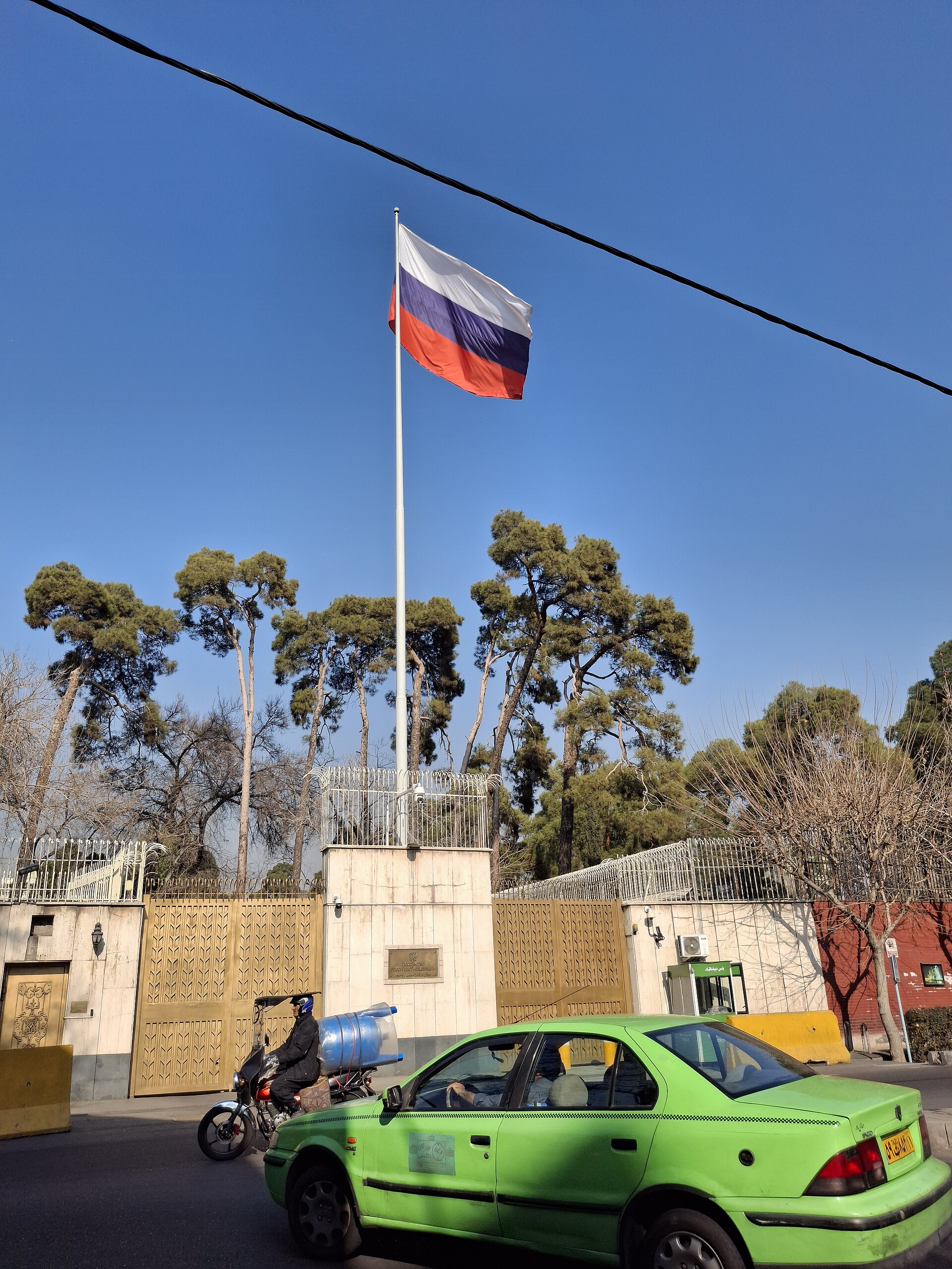 Russian Embassy in Tehran, Iran, with Russian tricolor flag flying above the compound entrance, 2025