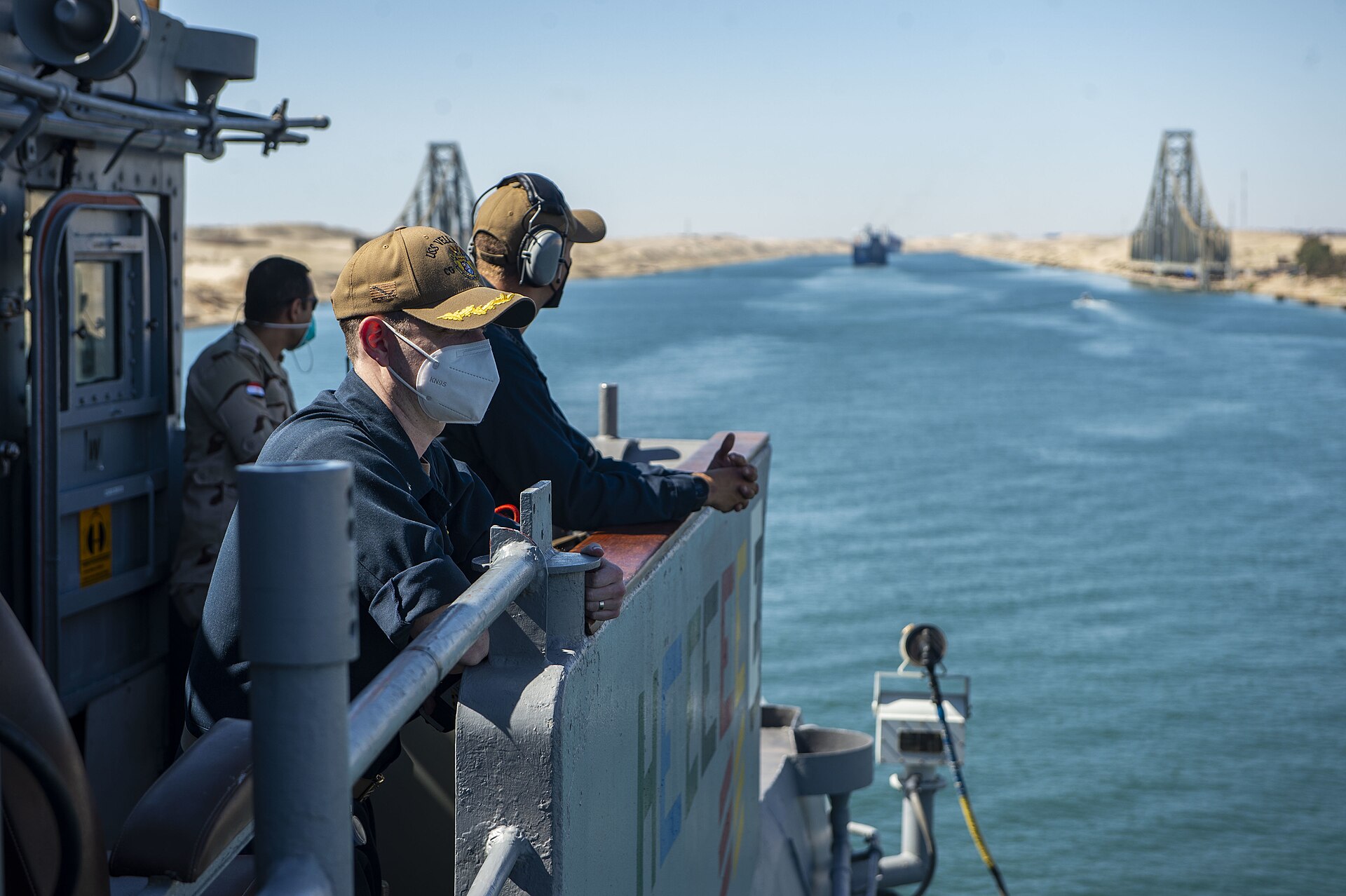 US Navy guided-missile cruiser USS Vella Gulf transiting the Suez Canal with Egyptian landscape visible, May 2021