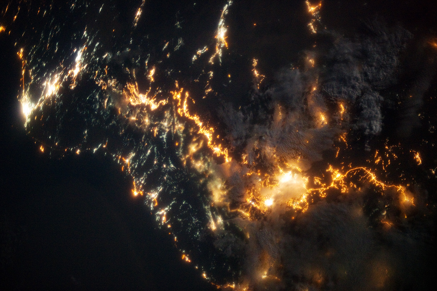Southwestern Saudi Arabia at night photographed from the International Space Station, showing city lights of Abha (center-right) and Khamis Mushait, home to King Khalid Air Base.