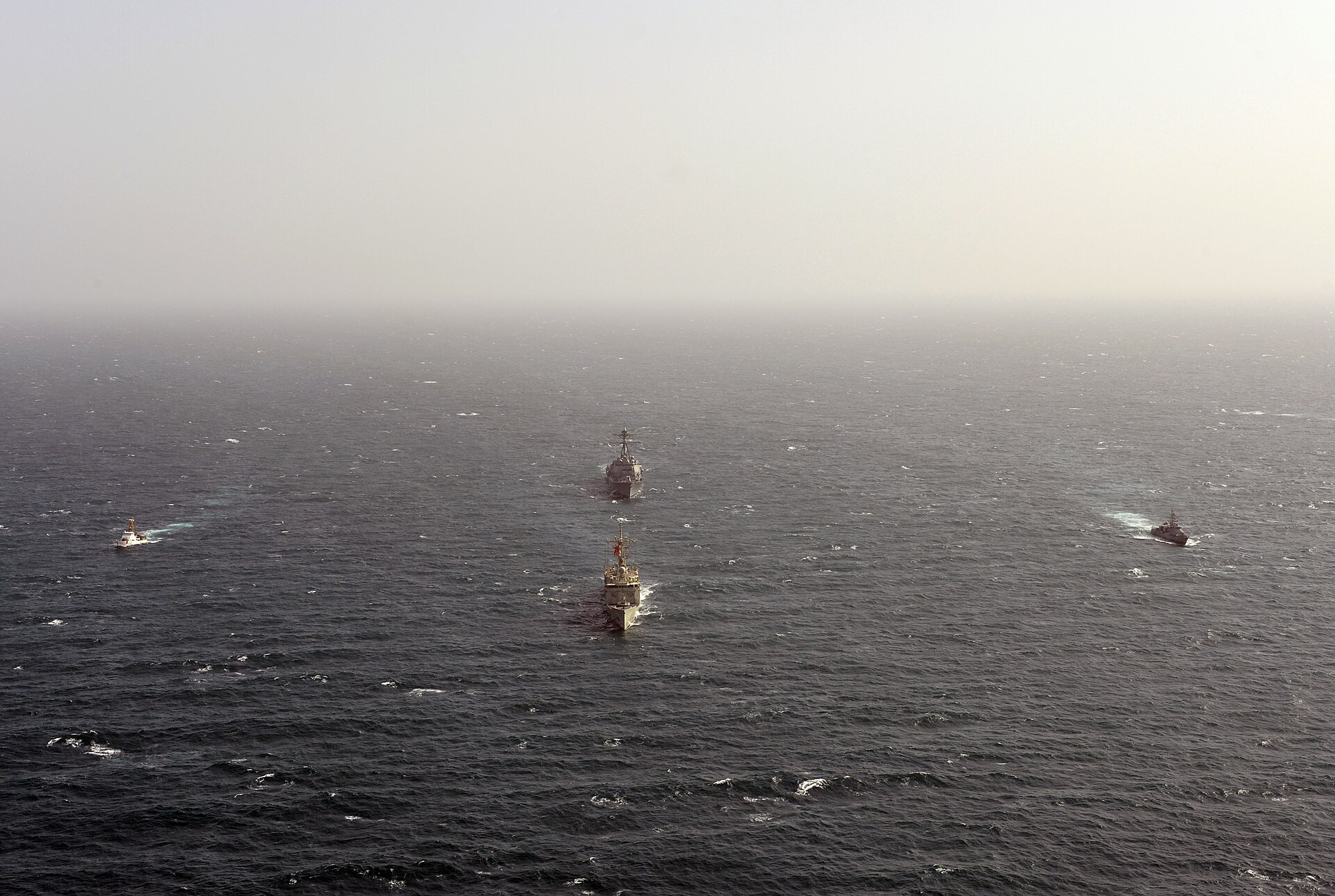 US Navy guided-missile destroyer USS William P. Lawrence and Royal Bahrain Naval Forces frigate Sabah transit the Arabian Gulf during Exercise Neon Falcon, March 2013
