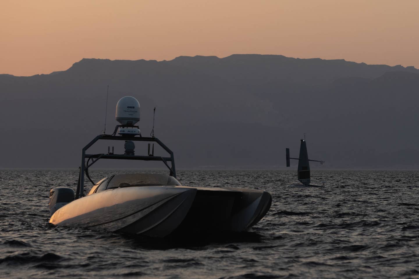 US Navy Devil Ray T-38 unmanned surface vessel transiting the Gulf of Aqaba during Exercise Eager Lion 2022, alongside a Saildrone Explorer autonomous maritime drone