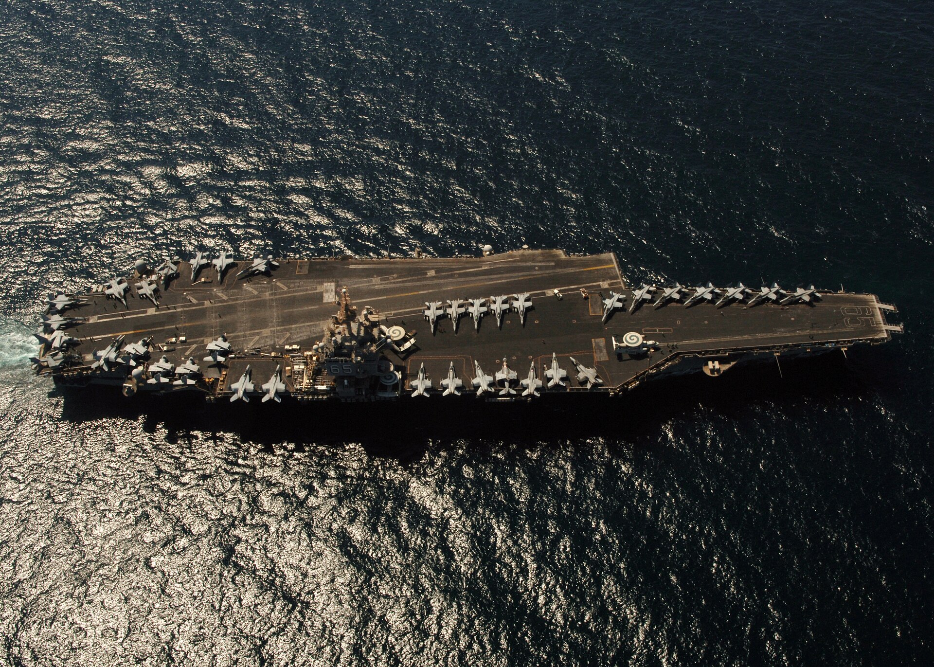 USS Enterprise aircraft carrier transiting the Persian Gulf, showing US Navy strike aviation capability in the theater