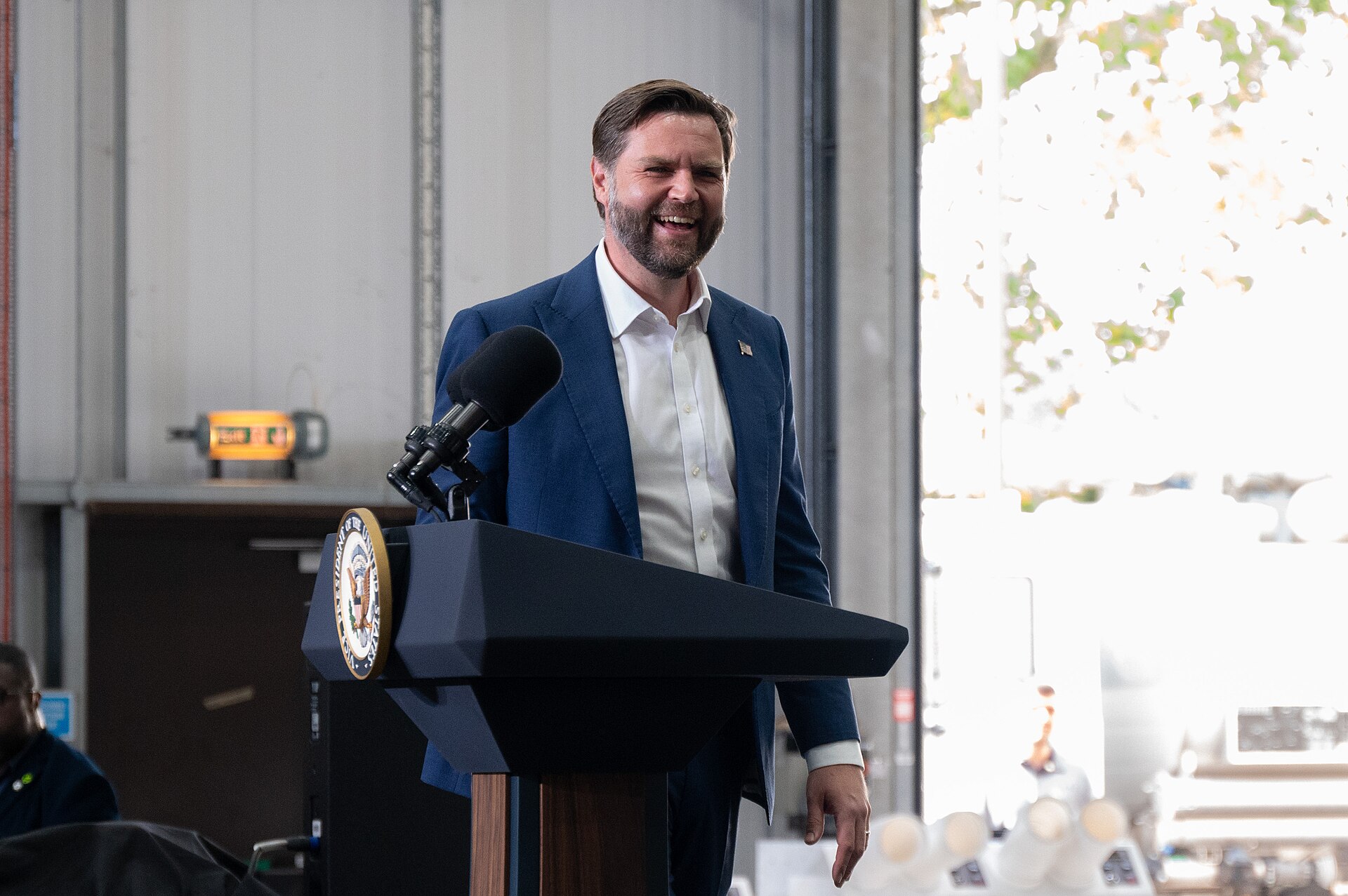 Vice President JD Vance speaks at a podium bearing the seal of the Vice President of the United States, RAF Fairford, England, August 2025