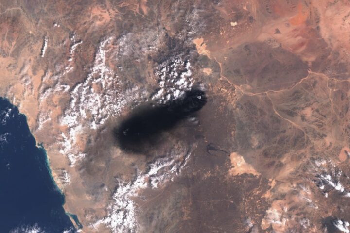 Satellite image showing black smoke plume rising from the East-West Crude Oil Pipeline in Saudi Arabia